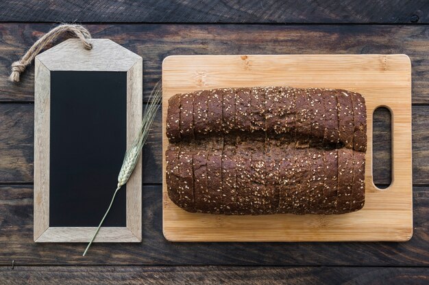 Cut bread near blackboard