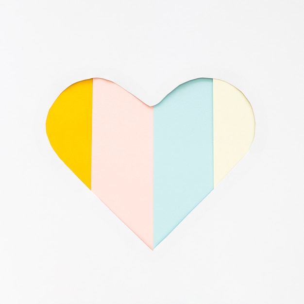 Free Photo cut heart shape from paper on striped table