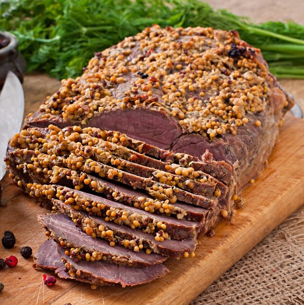 Cut pieces of baked meat on the table