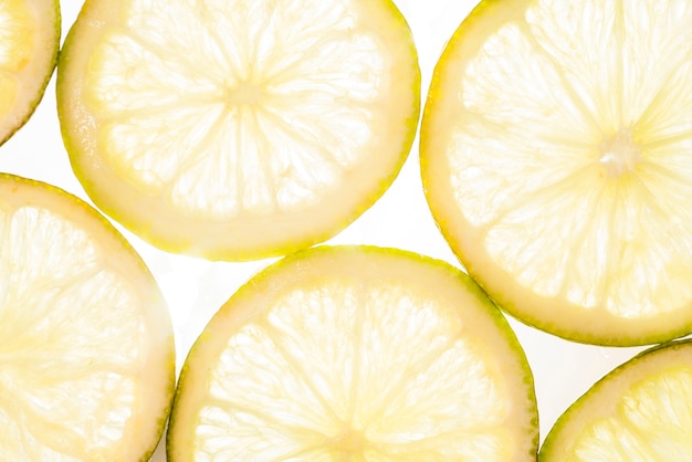 Free photo cut slices of lemon in sunlight