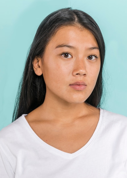 Cute asian woman looking at camera portrait 