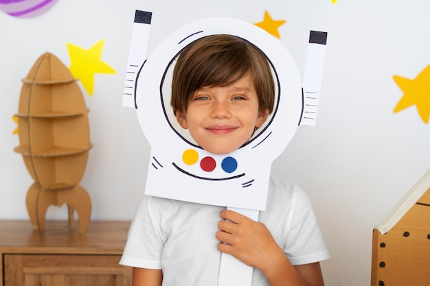 Free Photo cute astronaut kid playing