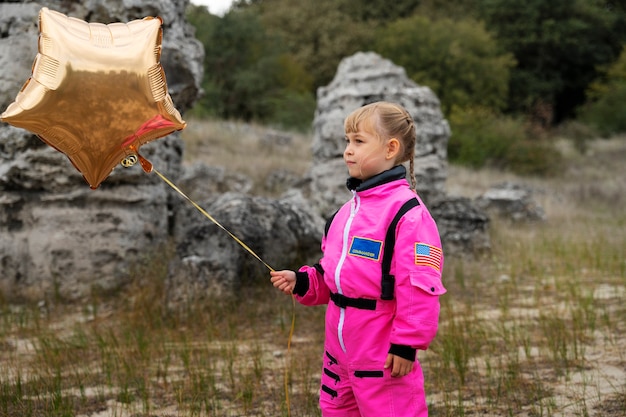 Free Photo cute astronaut kid playing