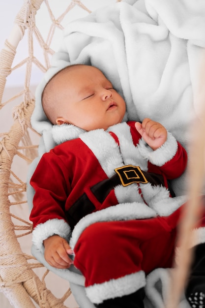 Cute baby dressed in santa claus clothing