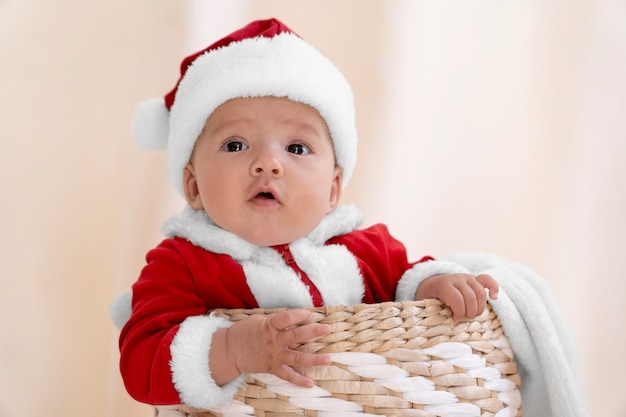 Cute baby dressed in santa claus clothing