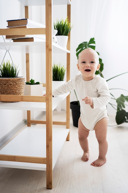 Cute baby going for their first steps