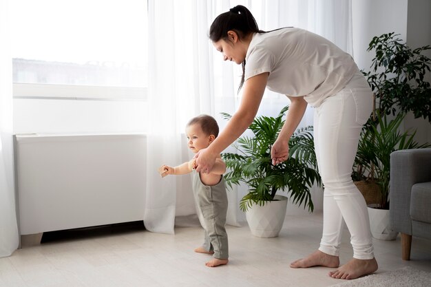 Cute baby going for their first steps