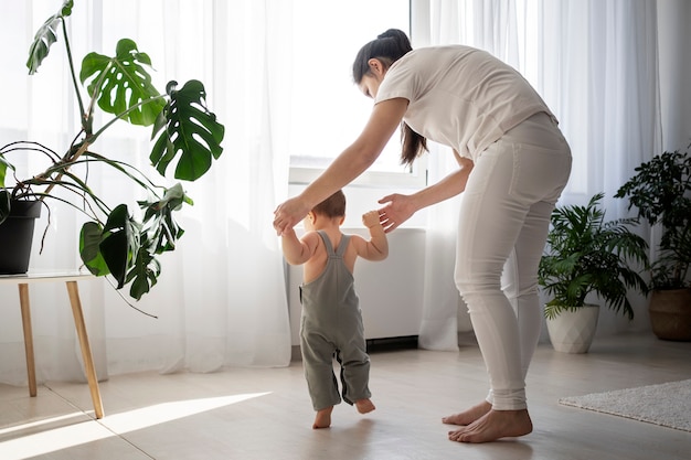 Cute baby going for their first steps