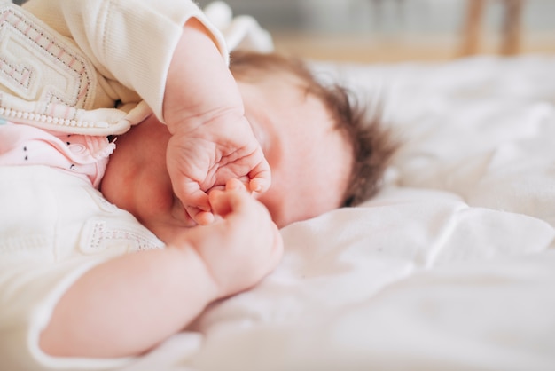 Cute baby sleeping on blanket