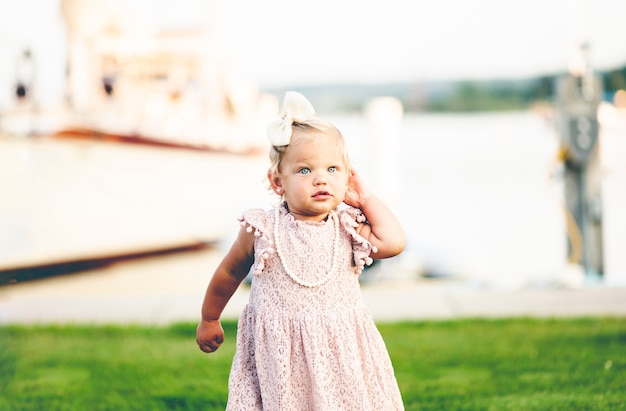 Free photo cute baby with elegant dress