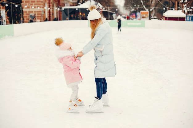 Cute and beautiful family in a winter city