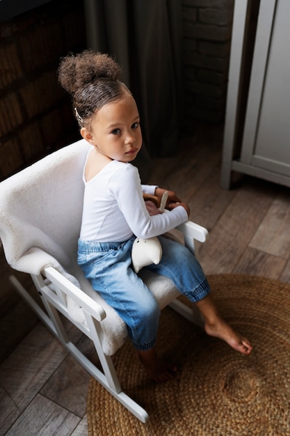 Cute black baby having fun at home