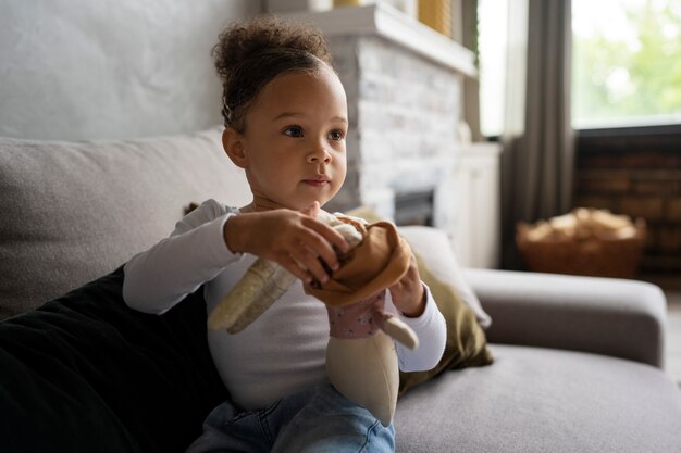 Cute black baby having fun at home