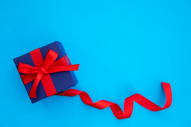 Cute blue and red gift with ribbon