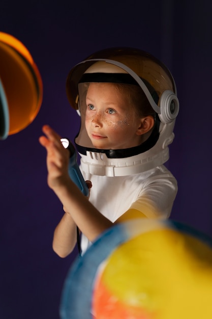 Free Photo cute boy dressed in space astronaut