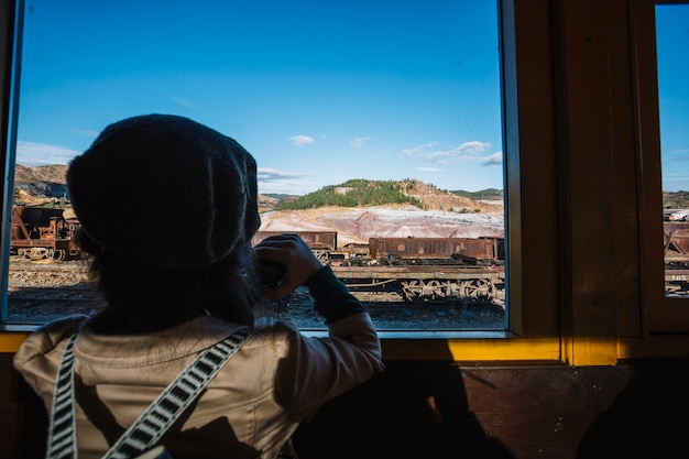 Cute boy looking at train window