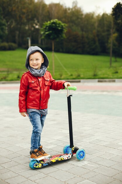 Cute child in a park playing on a grass