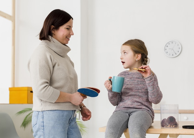 Cute child talking to mother