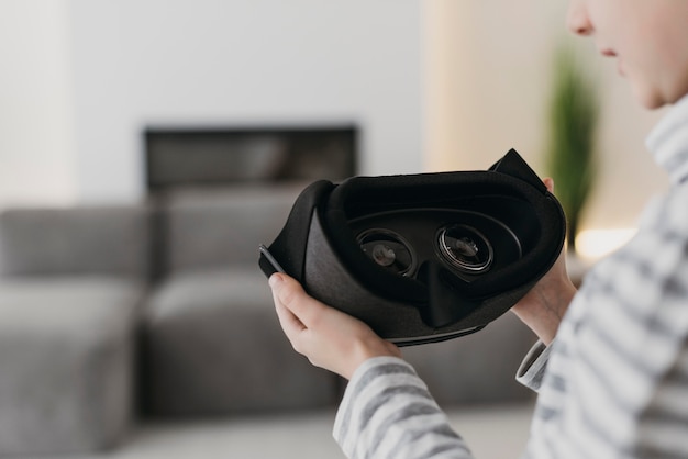 Free Photo cute child using virtual reality headset blurred background