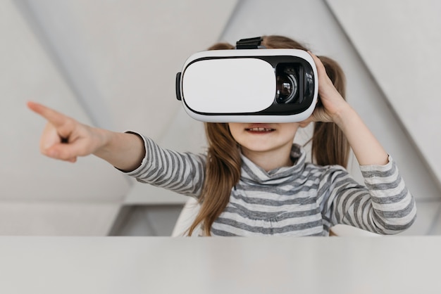 Cute child using virtual reality headset