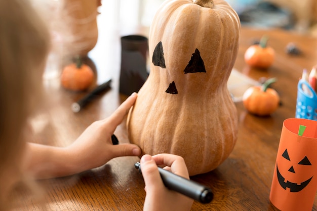 Free Photo cute children with pumpkins halloween concept