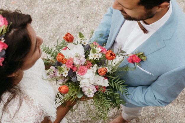 Cute couple celebrating their wedding on the beach