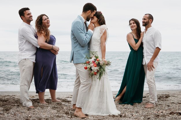 Cute couple celebrating their wedding on the beach