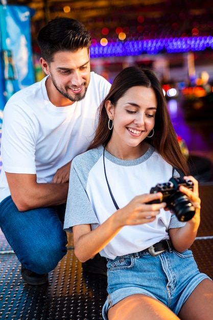 Cute couple at fair looking at camera