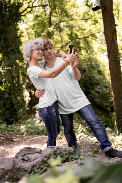 Cute couple in the park taking a selfie together