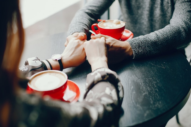 Cute couple spend time in a cafe