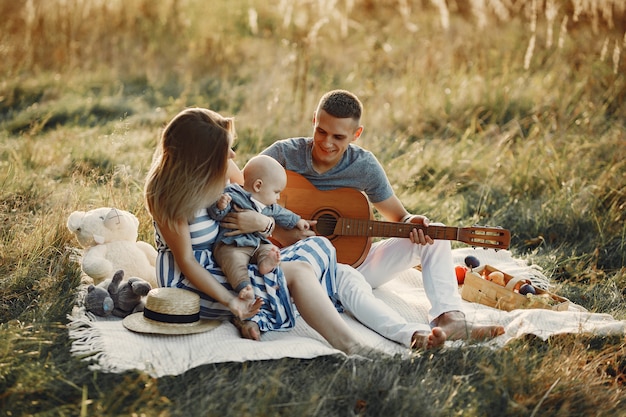 Free photo cute family playing in a autumn field