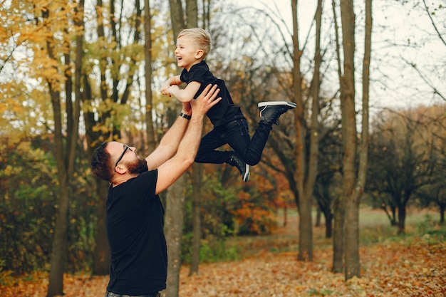 Cute family playing in a autumn park