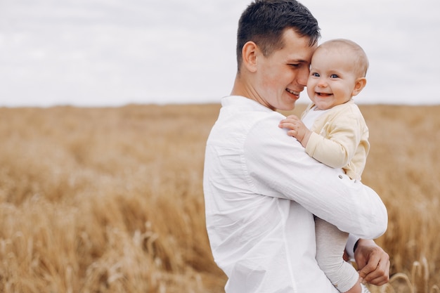 Cute family playing in a summer field