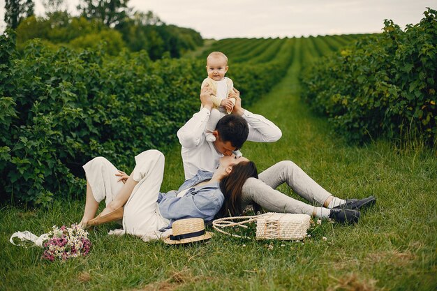 Cute family playing in a summer field