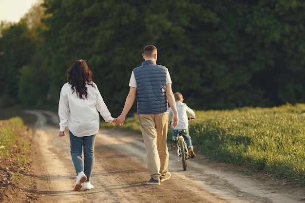 Cute family playing in a summer field