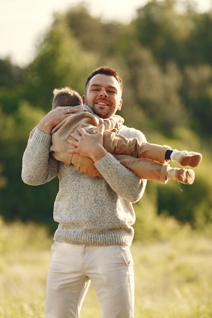 Free photo cute family playing in a summer field