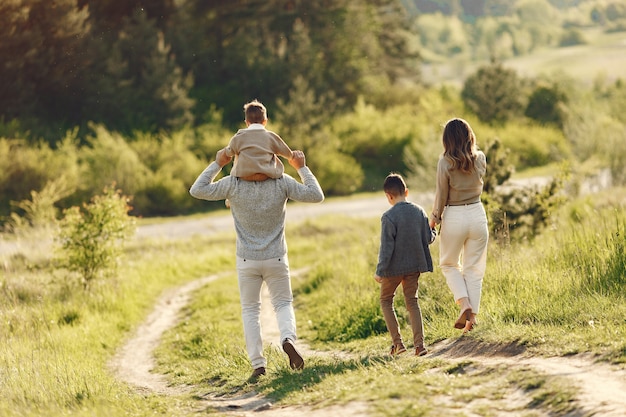 Cute family playing in a summer field