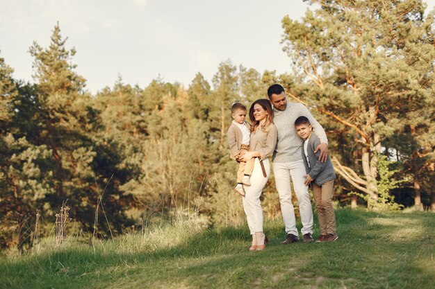 Cute family playing in a summer field