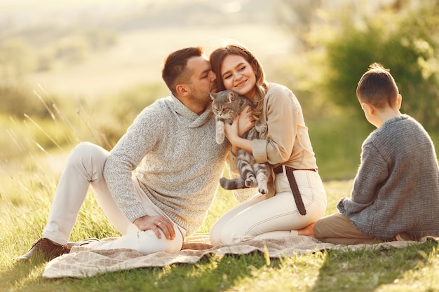 Cute family playing in a summer field