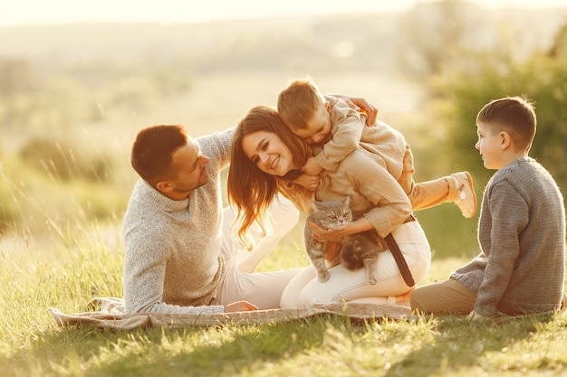 Cute family playing in a summer field