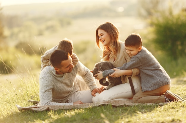 Cute family playing in a summer field