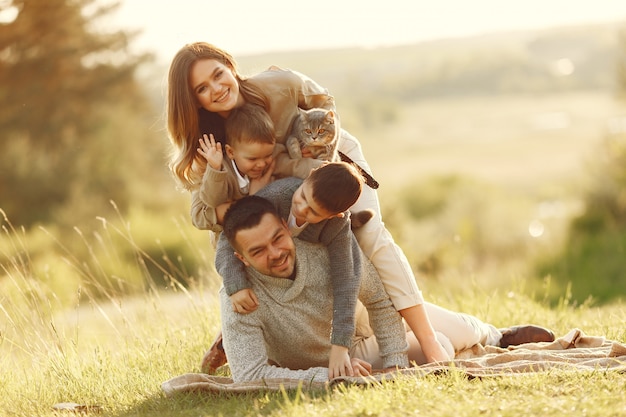 Cute family playing in a summer field