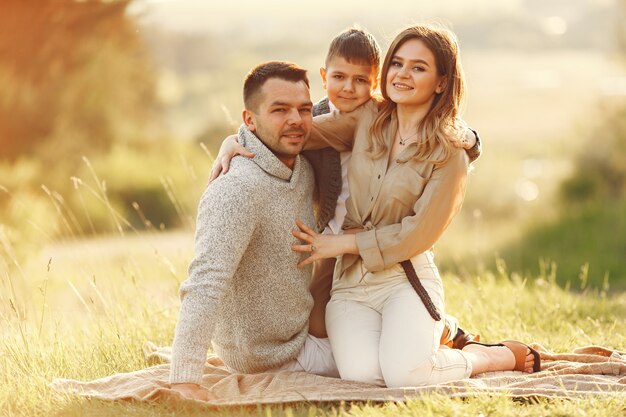 Cute family playing in a summer field