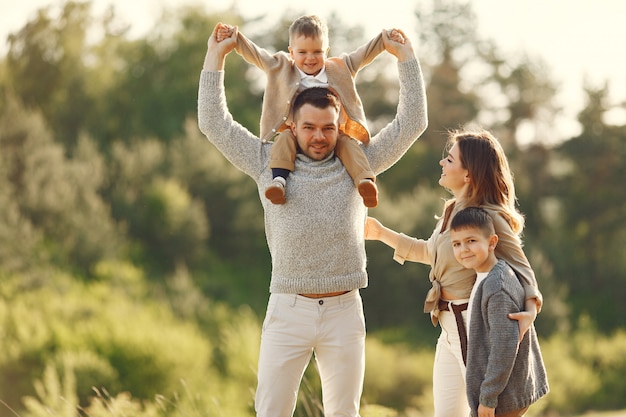 Cute family playing in a summer field