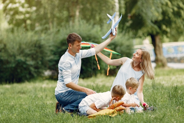 Cute family playing in a summer field