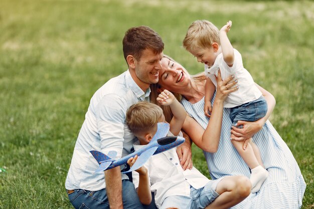 Cute family playing in a summer field