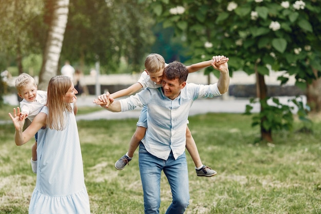 Cute family playing in a summer field