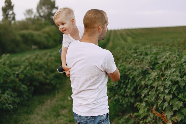 Cute family playing in a summer field