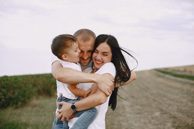 Cute family playing in a summer field