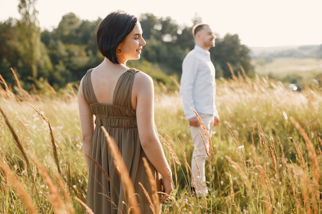 Free Photo cute family spending time in a summer field